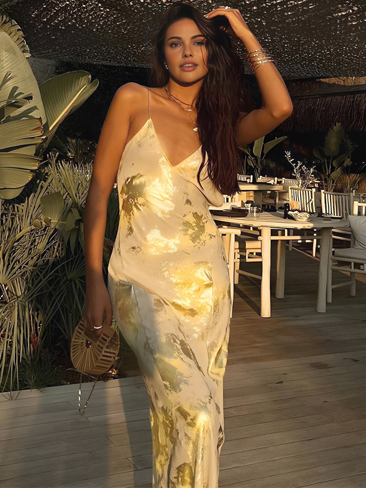 Chic yellow gold floral maxi dress for women. This elegant summer dress is perfect for evening functions and weddings.