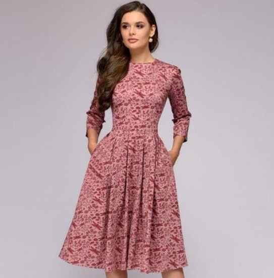 Elegant women's A-line knee-length dress with vibrant floral print, fitted waist, 3/4 sleeves, perfect for spring occasions.