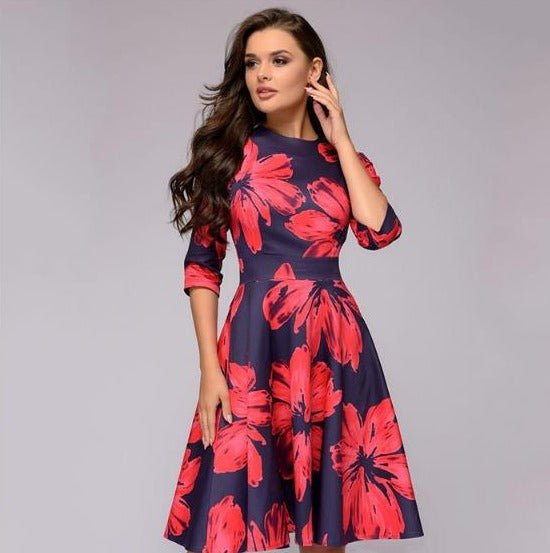 Elegant women's A-line knee-length dress with vibrant floral print, fitted waist, 3/4 sleeves, perfect for spring occasions.
