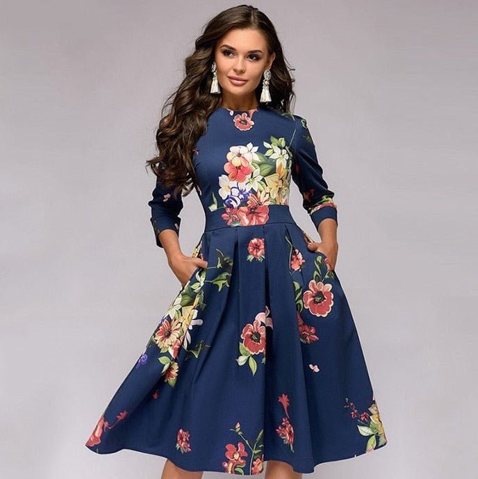 Elegant women's A-line knee-length dress with vibrant floral print, fitted waist, 3/4 sleeves, perfect for spring occasions.