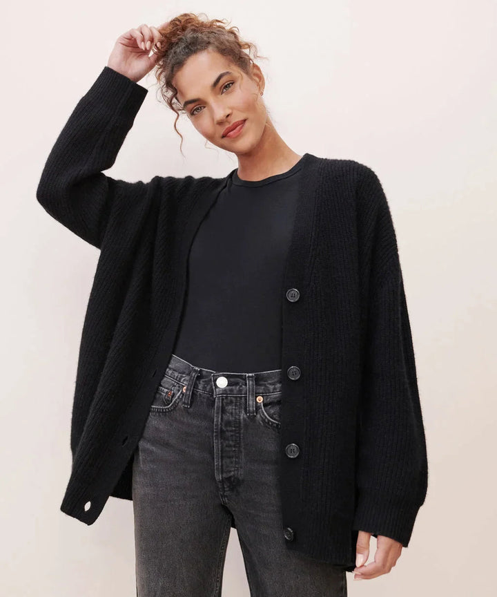 Elegant women's cashmere V-neck cardigan; soft, lightweight fabric in chic colors; perfect for layering and adding style.