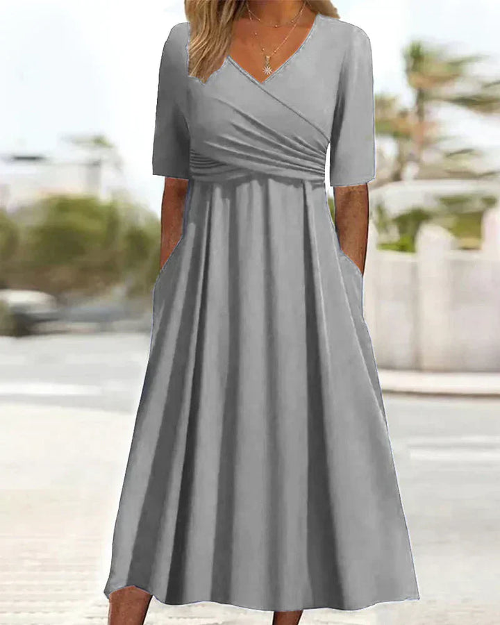 Elegant women's maxi dress with chic V-neck, A-line silhouette, and side pockets, perfect for casual and formal events.