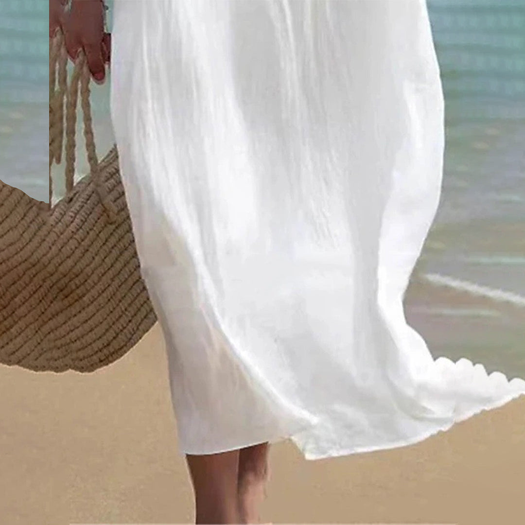 "Elegant women's white maxi dress, flowing silhouette, ideal for summer beach outings and casual elegance."