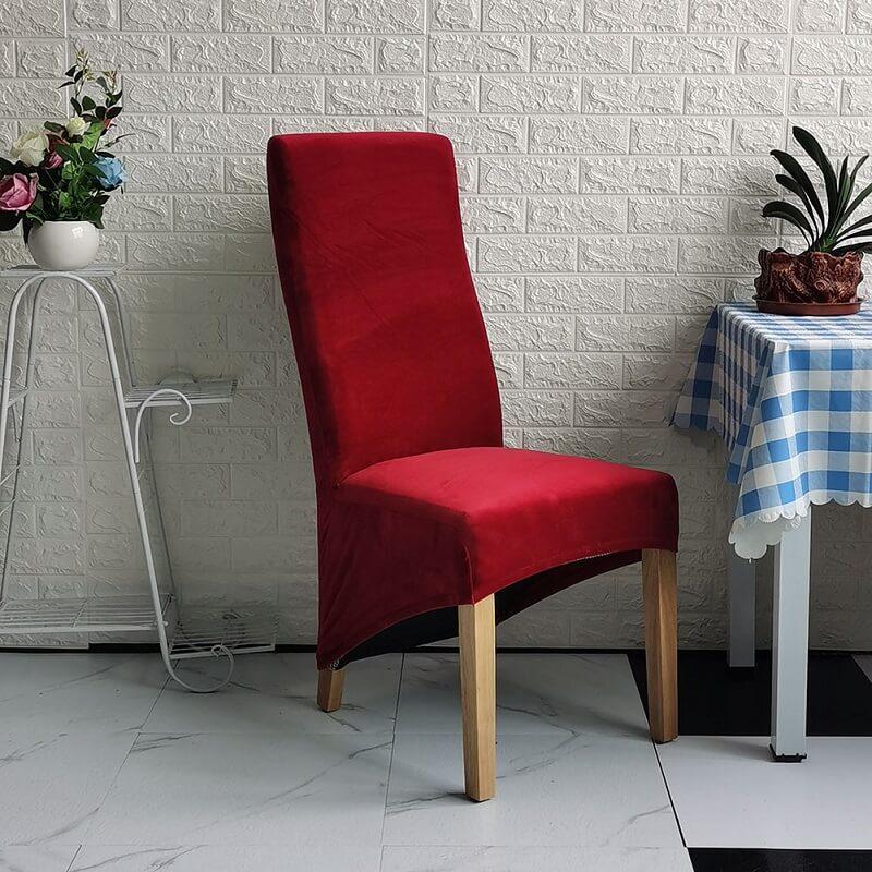 Elegant XL stretch velvet dining chair cover in camel, showcases plush velvet texture, ideal for home or events, fits armless chairs.