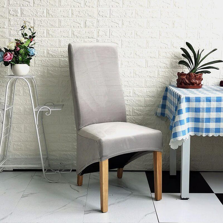 Elegant XL stretch velvet dining chair cover in camel, showcases plush velvet texture, ideal for home or events, fits armless chairs.