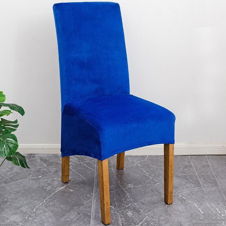 Elegant XL stretch velvet dining chair cover in camel, showcases plush velvet texture, ideal for home or events, fits armless chairs.