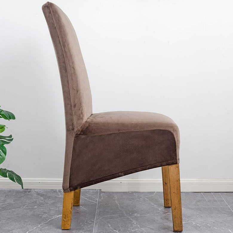 Elegant XL stretch velvet dining chair cover in camel, showcases plush velvet texture, ideal for home or events, fits armless chairs.