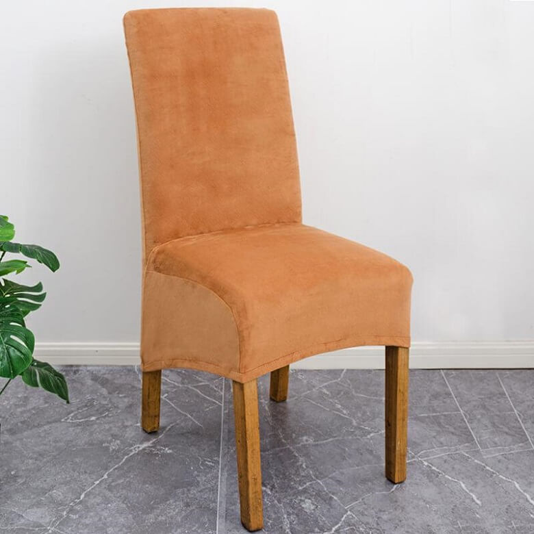 Elegant XL stretch velvet dining chair cover in camel, showcases plush velvet texture, ideal for home or events, fits armless chairs.