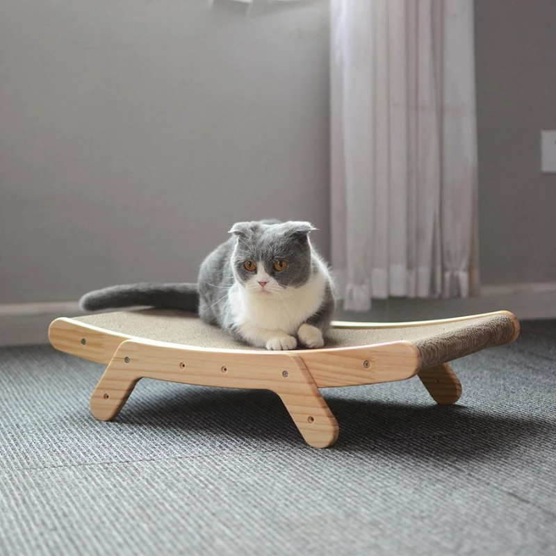 Ergonomic cat scratcher with sleek solid wood frame; curvy design offers comfort and stylish play area for feline exercise.