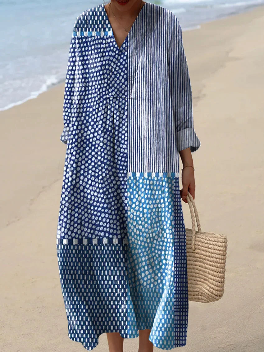Flattering women's blue casual dress for everyday wear. Comfortable, versatile, and flowy, perfect for spring/summer fashion.