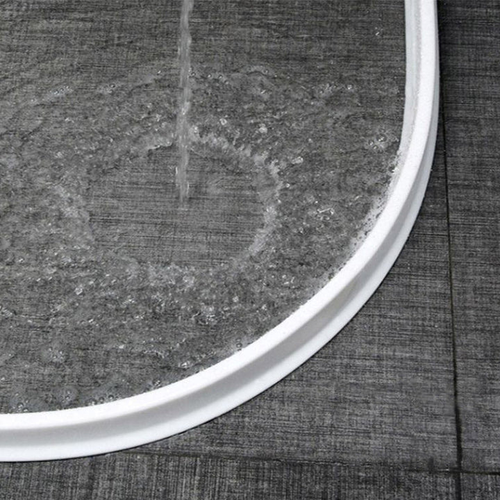 "Flexible waterproof silicone shower seal for leak prevention, shown in sleek design, ideal for bathroom water barrier."