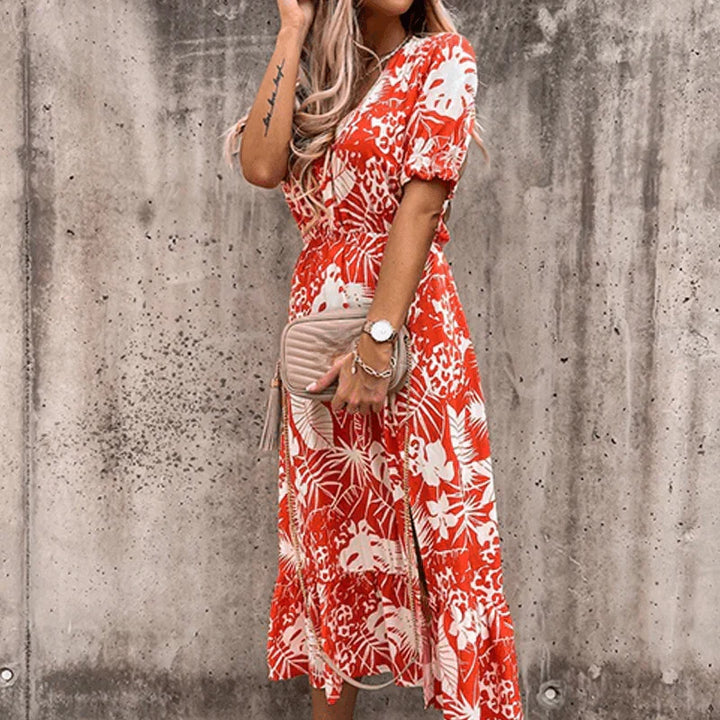 Floral button-front maxi dress with side slit, vibrant floral print, perfect for casual or formal occasions.