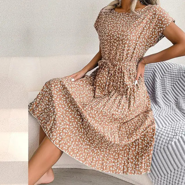 "Floral short-sleeve pleated midi dress with waist tie, offering elegance and comfort for any occasion"