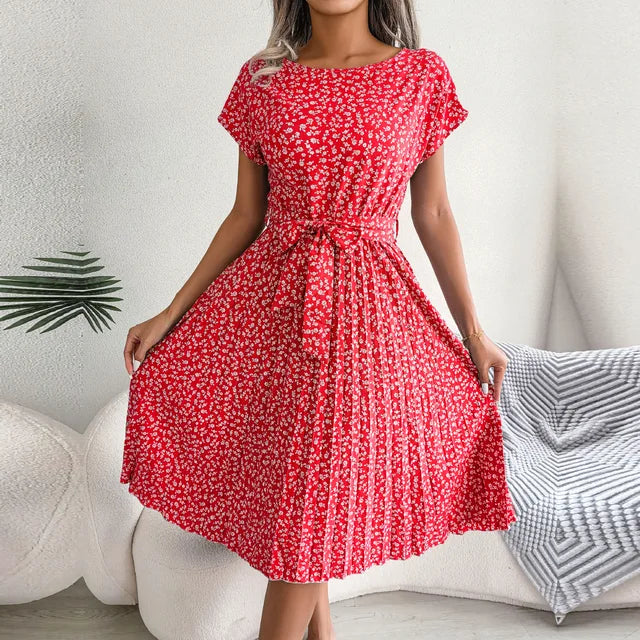 "Floral short-sleeve pleated midi dress with waist tie, offering elegance and comfort for any occasion"