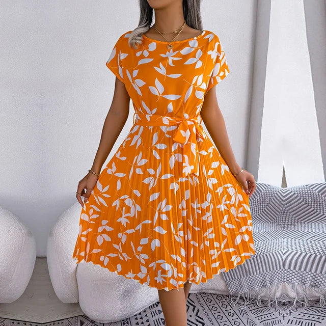 "Floral short-sleeve pleated midi dress with waist tie, offering elegance and comfort for any occasion"