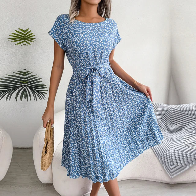 "Floral short-sleeve pleated midi dress with waist tie, offering elegance and comfort for any occasion"