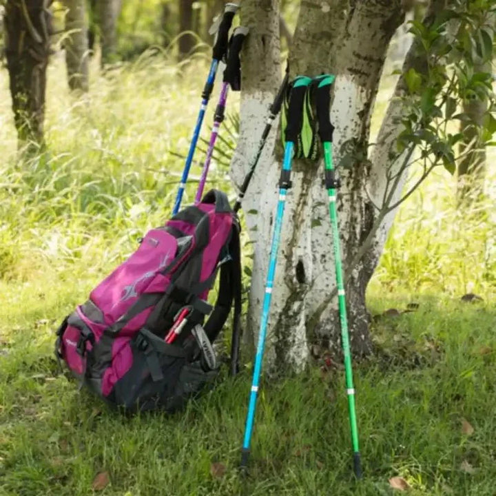 Foldable aluminum trekking pole with adjustable height, lightweight and portable, ideal for hiking, shown in multiple colors.