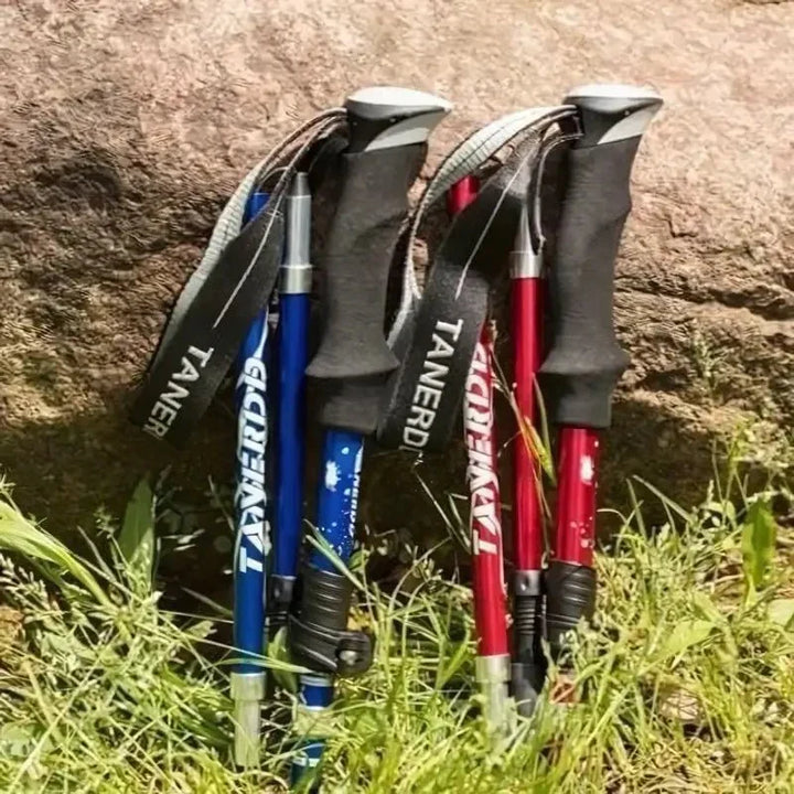 Foldable aluminum trekking pole with adjustable height, lightweight and portable, ideal for hiking, shown in multiple colors.