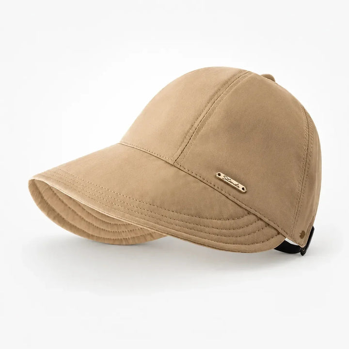 Women's foldable wide-brim sun hat with UPF 50+ UV protection, ideal for beach & travel.