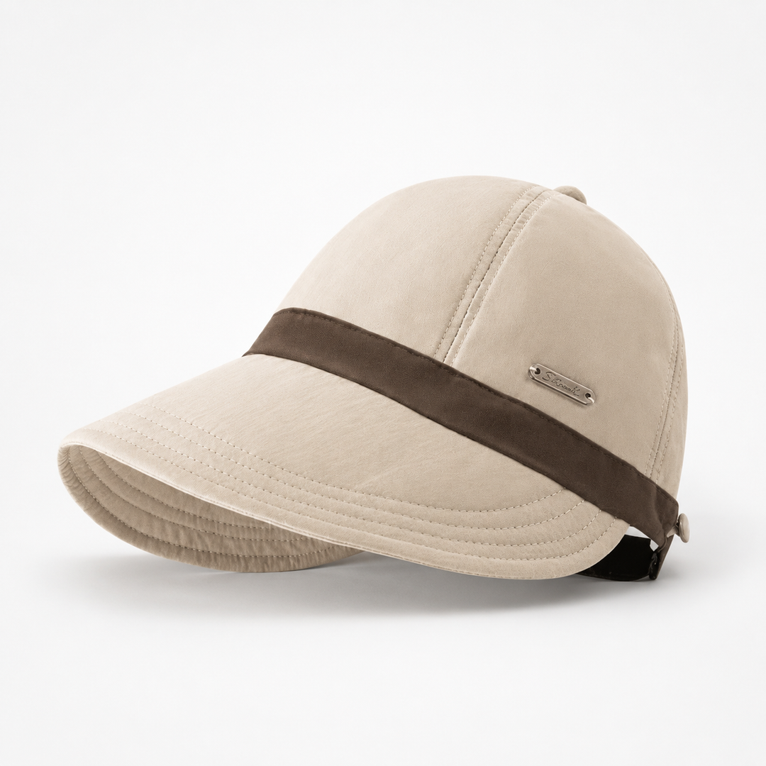 Chic women's wide-brim sun hat. Foldable, UPF 50+ UV protection, adjustable for summer adventures.