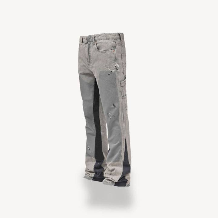 "Front view of men's slim fit stacked jeans in black, gray, blue, showing modern streetwear style and extended leg length."