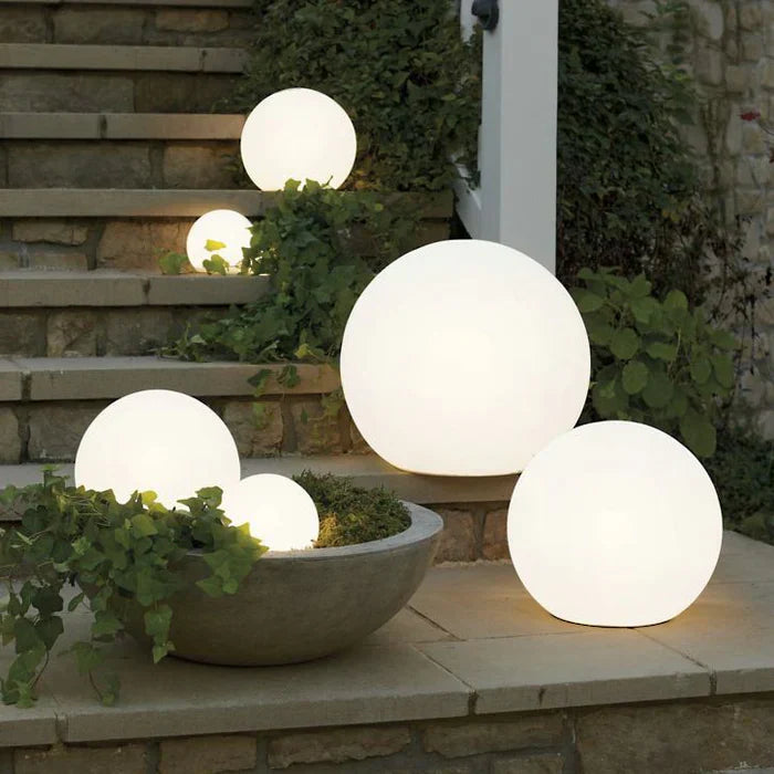 GlowSphere LED spherical garden light, waterproof & rechargeable for enchanting outdoor patio ambiance.