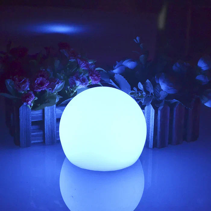Versatile spherical LED garden light, perfect for patio, lawn, & pool areas, with remote color control.