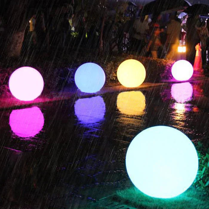 Collection of spherical LED garden lights, creating a captivating outdoor lighting arrangement & ambiance.