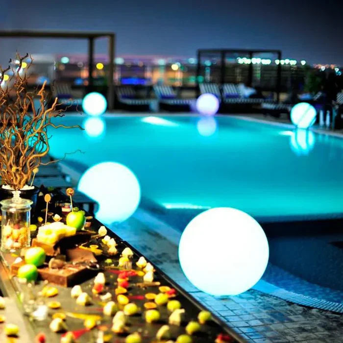 Spherical LED pathway light, guiding guests with soft, rechargeable illumination in your garden & outdoor space.