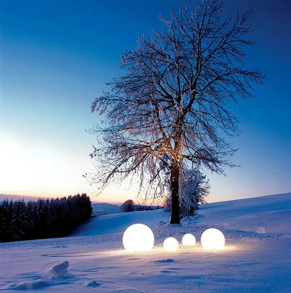 Dynamic color-changing spherical garden light, controlled via remote for personalized outdoor LED decor.