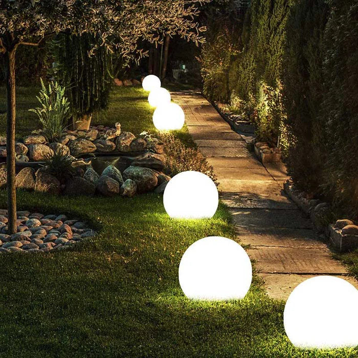Large spherical outdoor garden light, perfect for illuminating lawns & pathways with soft LED glow.