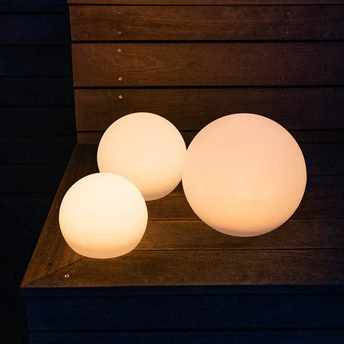 Color changing LED globe light with remote control, ideal for vibrant garden & patio decor.