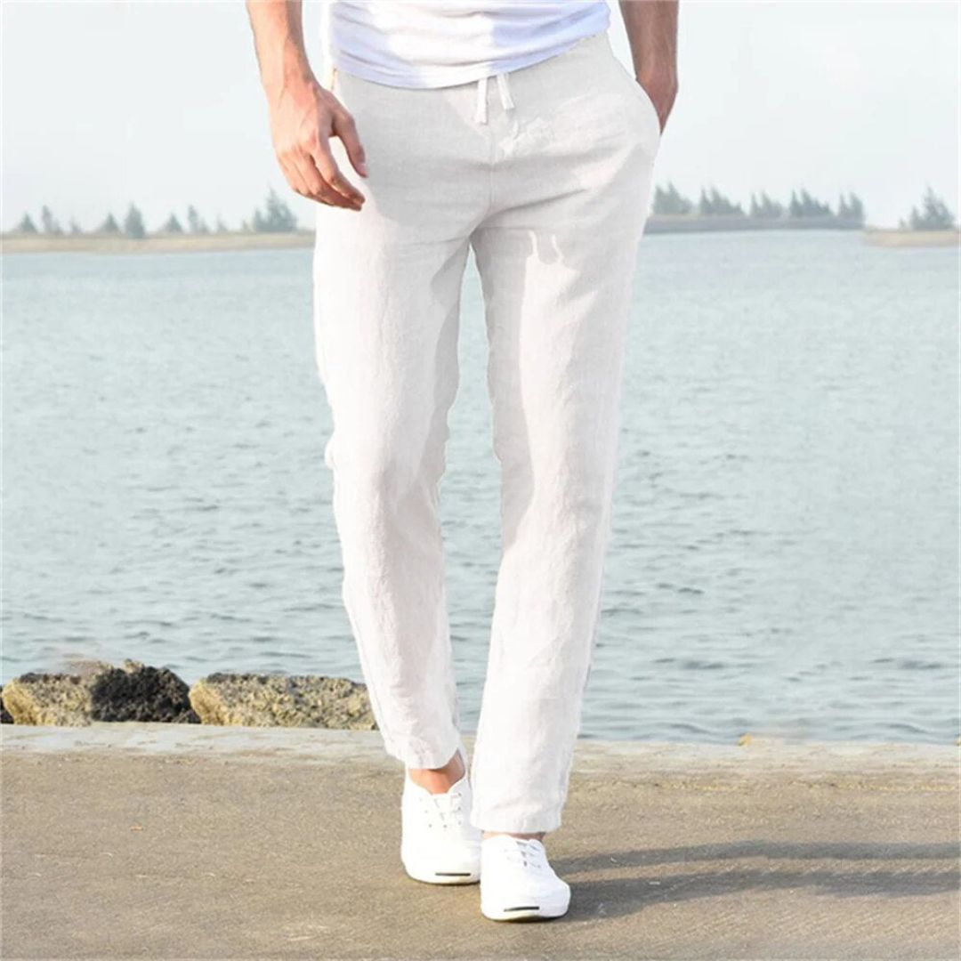 Gray lightweight linen summer pants with elastic waistband and pockets, perfect for men's casual or beach wear.