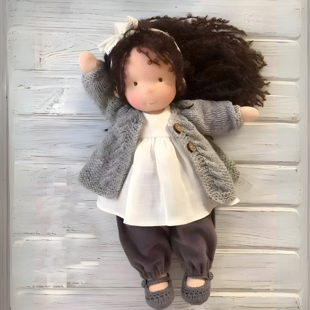 Educational Waldorf cuddly doll, handmade for nurturing and imaginative play.