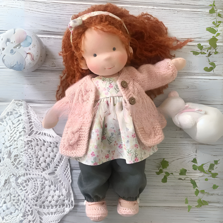 Soft Waldorf doll, natural wool and cotton, ideal for imaginative children's play.