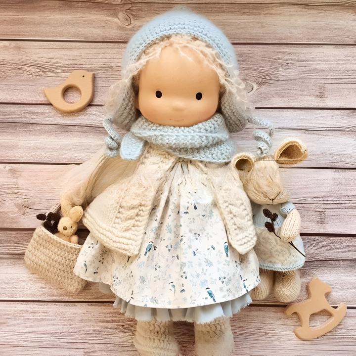 Waldorf wool doll, handmade and cuddly, perfect for imaginative and educational play.
