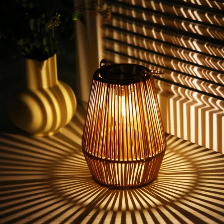 Handwoven rattan solar garden lamp, weatherproof LED outdoor decor for patio ambiance.