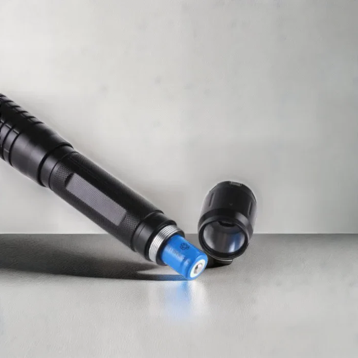 Powerful rechargeable laser flashlight, ideal for tactical outdoor use, hiking, and emergency situations.