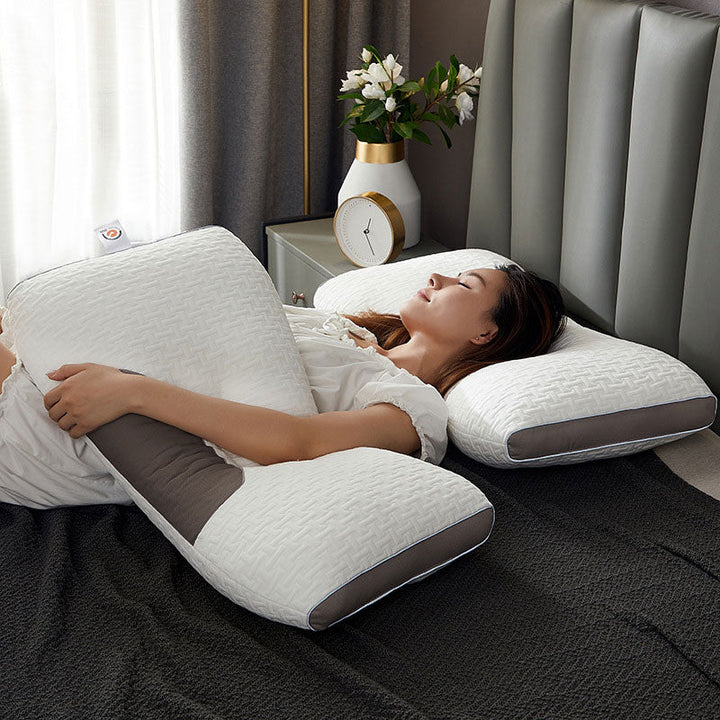 Hybrid pillow with ergonomic design, suited for back and side sleepers, featuring a neutral aesthetic and neck support.