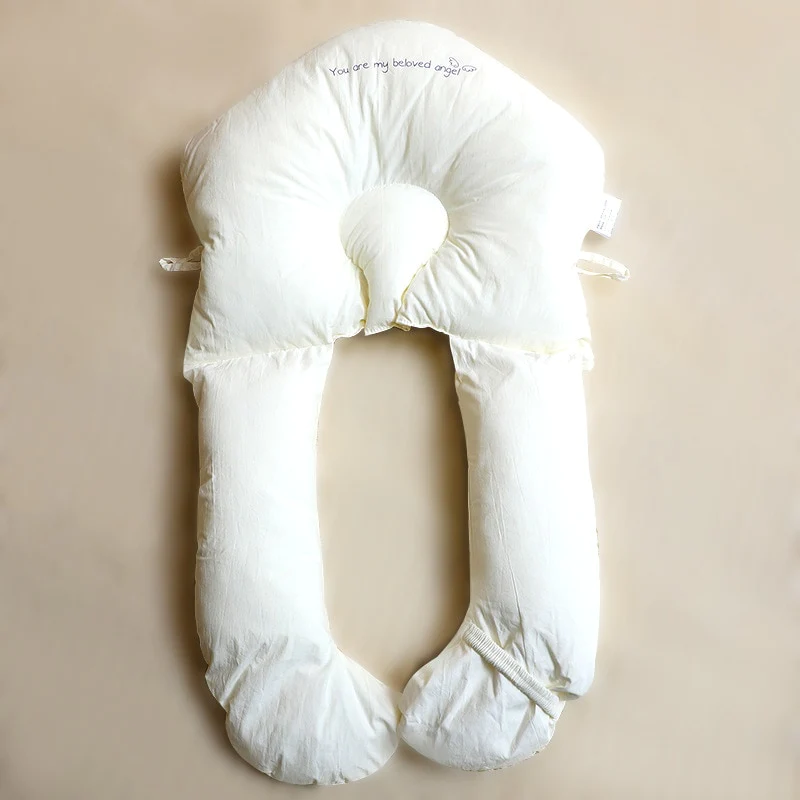 Premium hypoallergenic infant sleep pillow for gentle head & neck support, perfect for safe sleep in baby's nursery bedding.