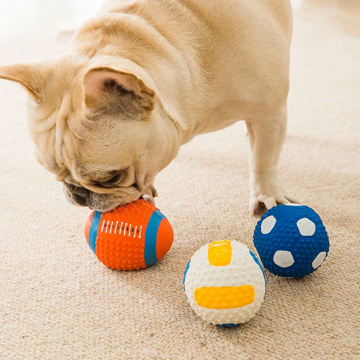 "Indestructible sports-themed chewballs for dogs in football, volleyball, rugby, and baseball designs - 4 pack set."