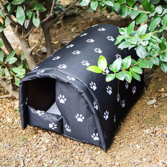 "Insulated waterproof outdoor cat house with all-weather protection, cozy interior, and removable cushion for easy cleaning."