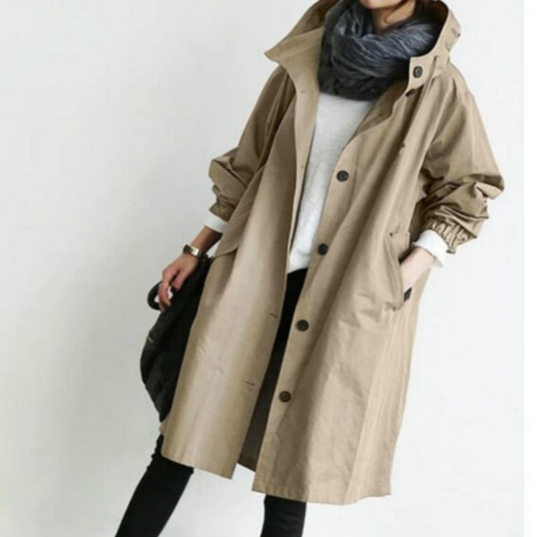 Woman wearing Isabelle's stylish long hooded trench coat, walking outdoors, perfect for spring.