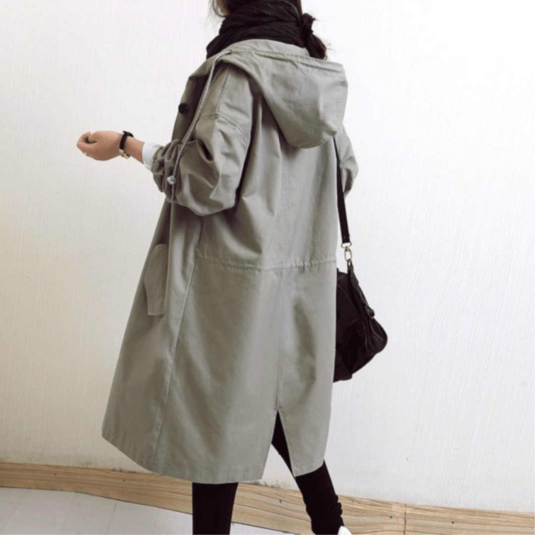 Detailed view of buttons and belt on the Isabelle women's elegant long hooded trench coat.