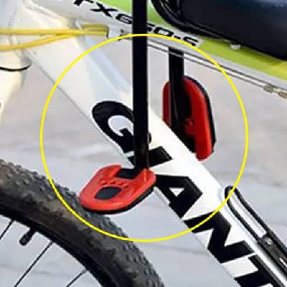 "Kids child bike seat in vibrant red and black with safety harness and padded seat, designed for adult bicycles."