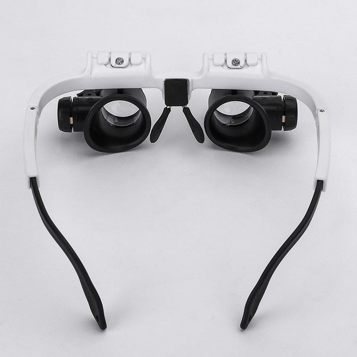 "LED-lit magnifier glasses with adjustable headband and up to 23x magnification for precision tasks and comfort."