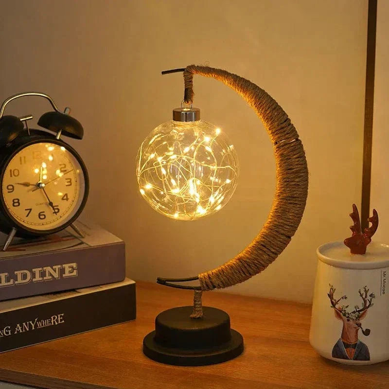 "LED Moon Star Night Light with hemp rope, moon-shaped, emits warm glow, ideal decor for cozy rooms, rustic charm."