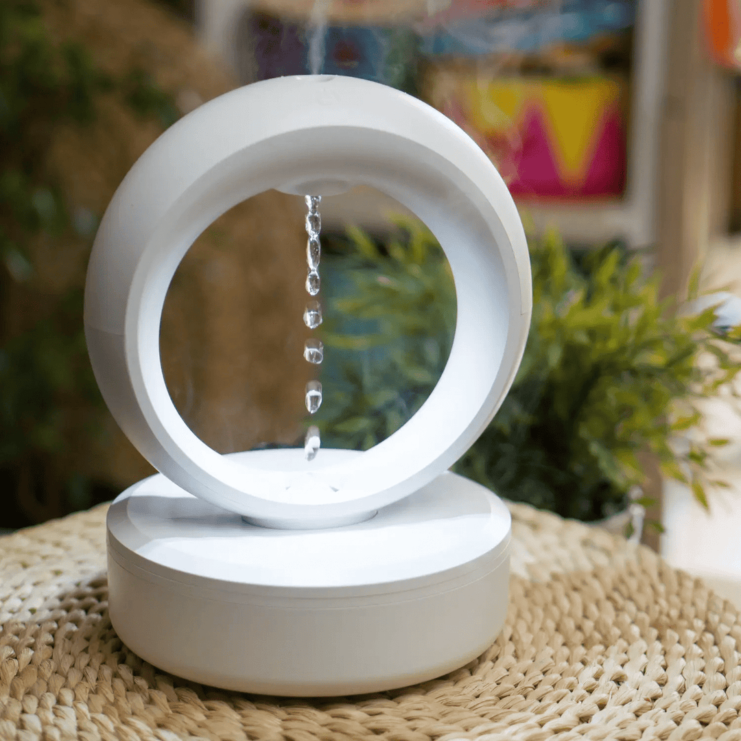 "Levitating Water Droplet Ultrasonic Humidifier with LED light, showing floating droplets effect, perfect for modern decor."