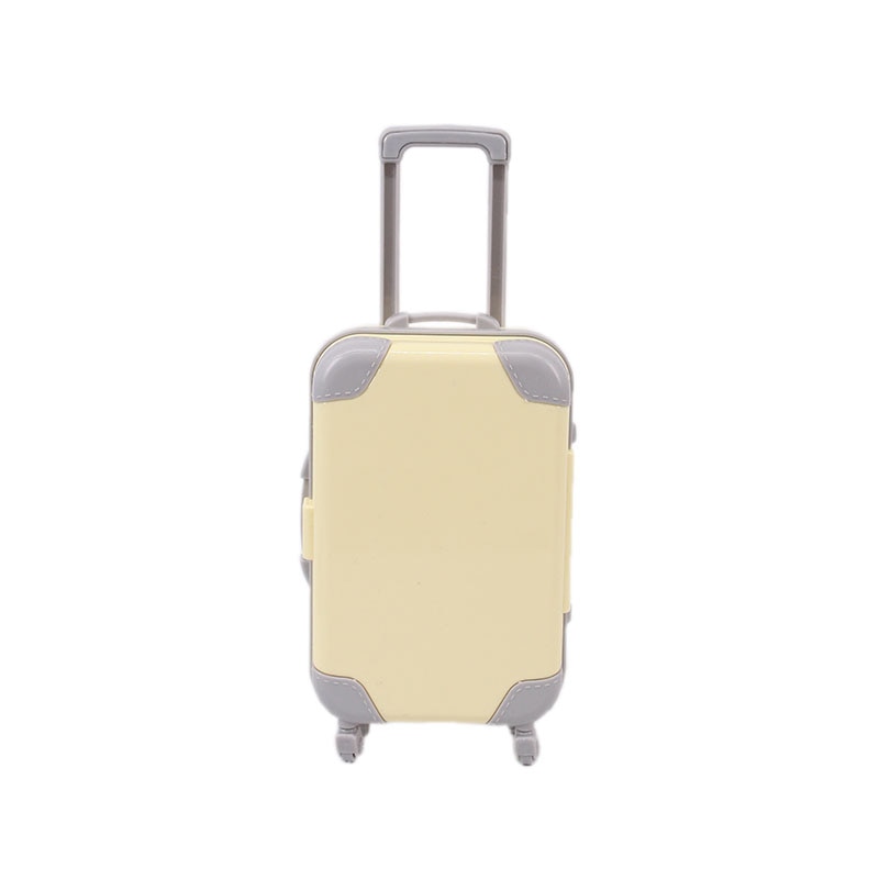 Colorful miniature travel suitcase for dolls, enhancing children's imaginative playtime.