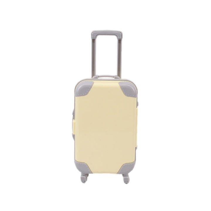 Colorful miniature travel suitcase for dolls, enhancing children's imaginative playtime.